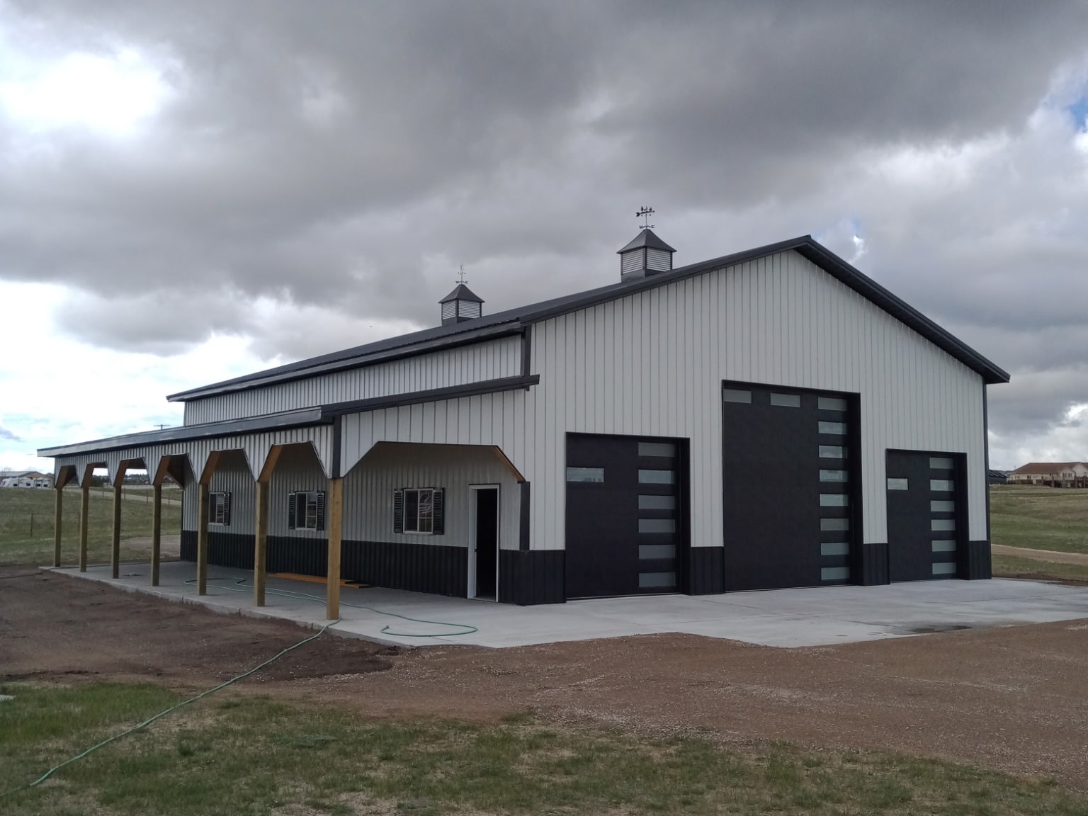 completed pole barn white grey metal