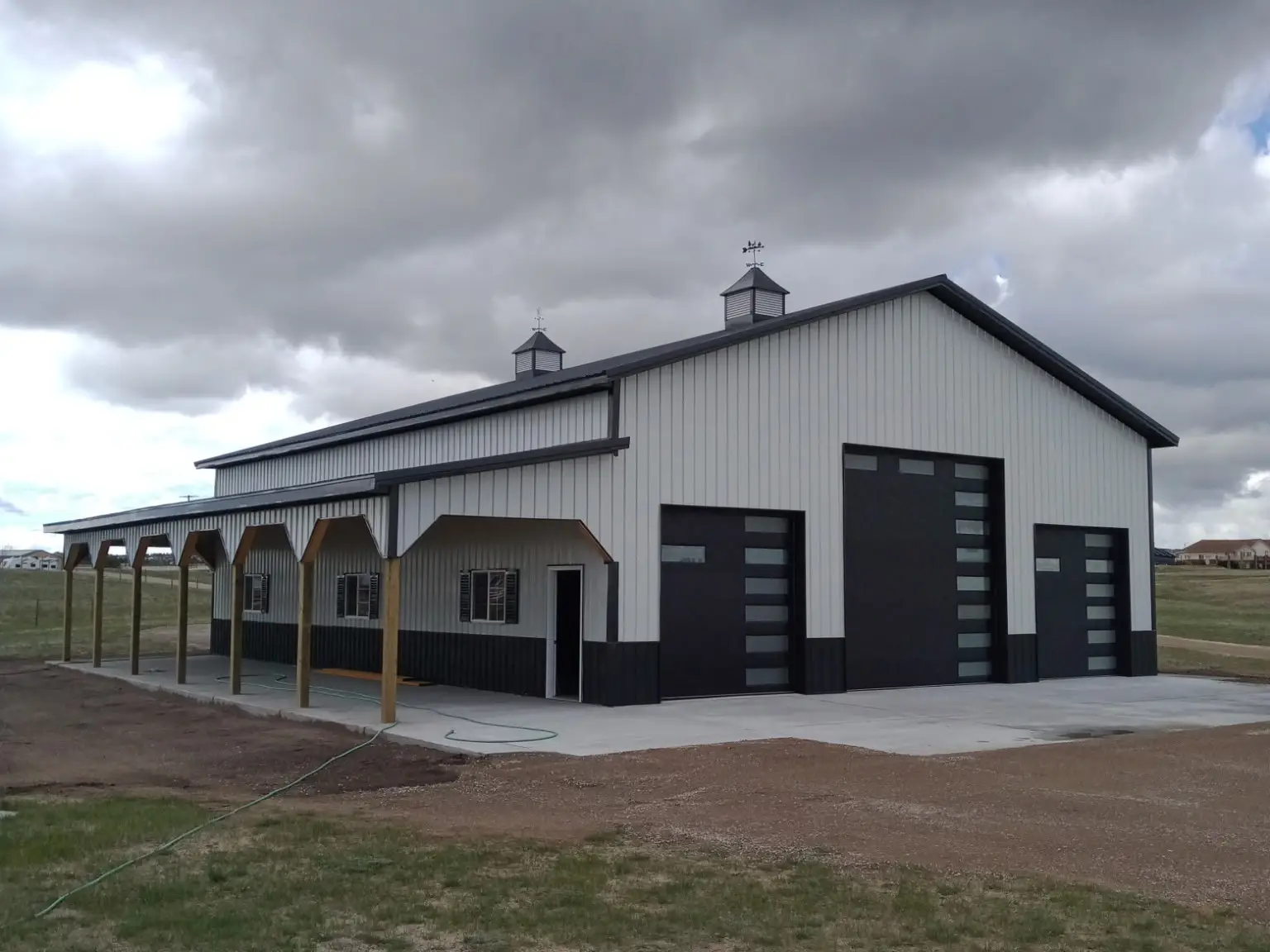 completed pole barn white grey metal