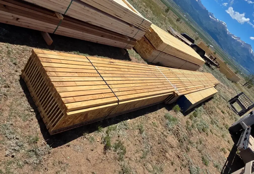 Deck boards and lumber with a Sangre de Cristo Mountain view