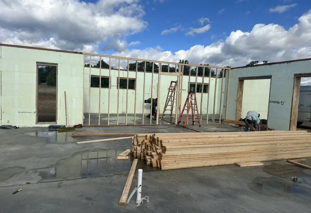 Home shell under construction with coordinated structural materials