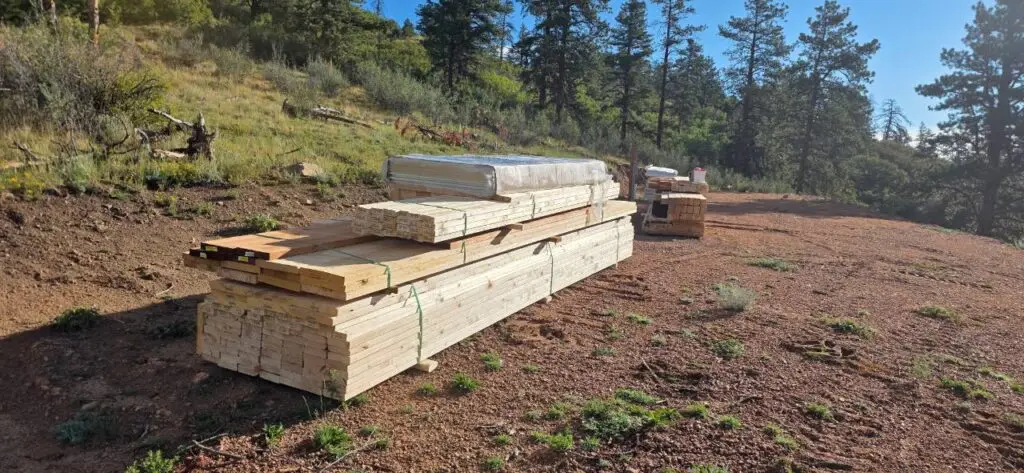 Pole barn materials staged at a Colorado mountain jobsite