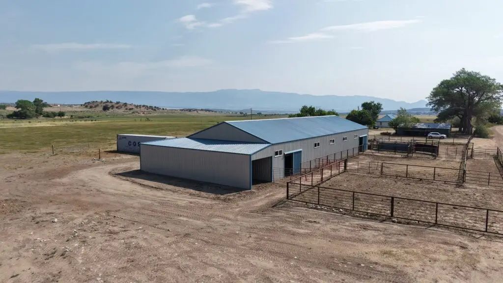 Side and rear view of a 40x104 calving barn connected to livestock corrals in Gardner, Colorado