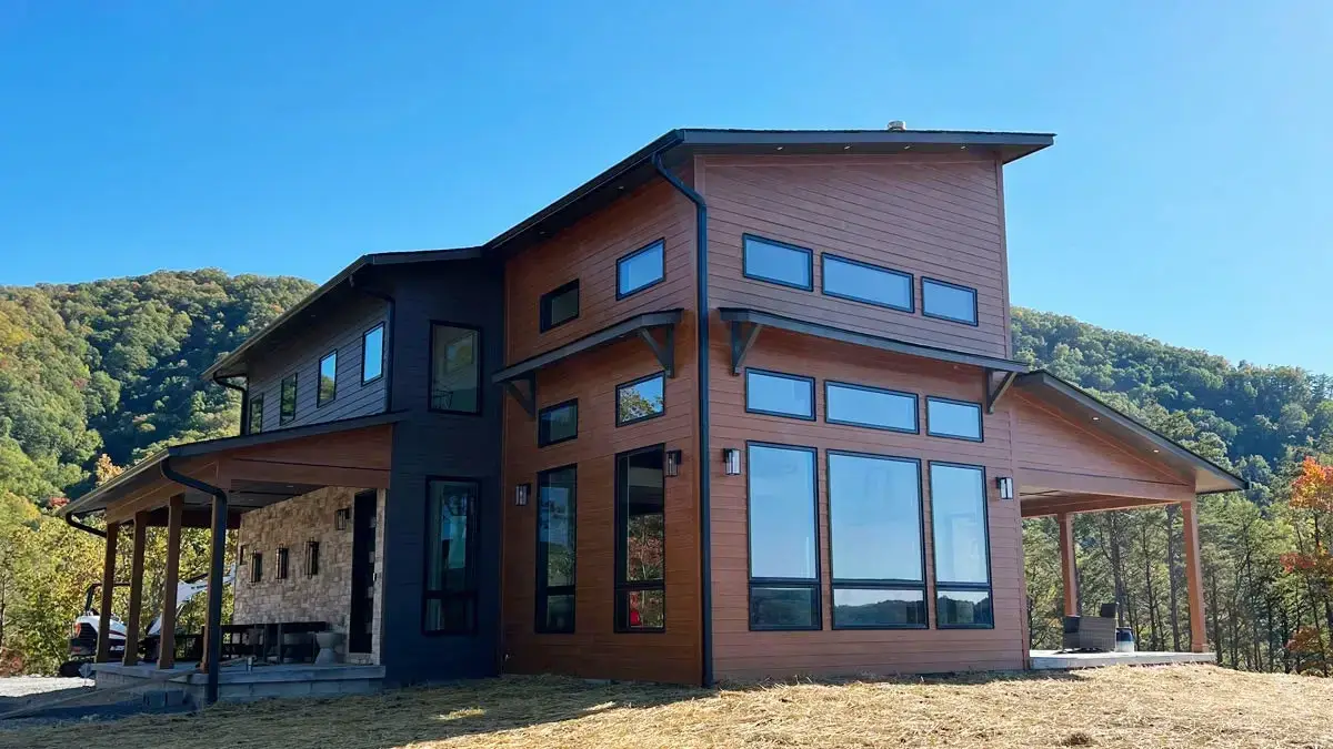 Finished two-story house with wood-tone siding